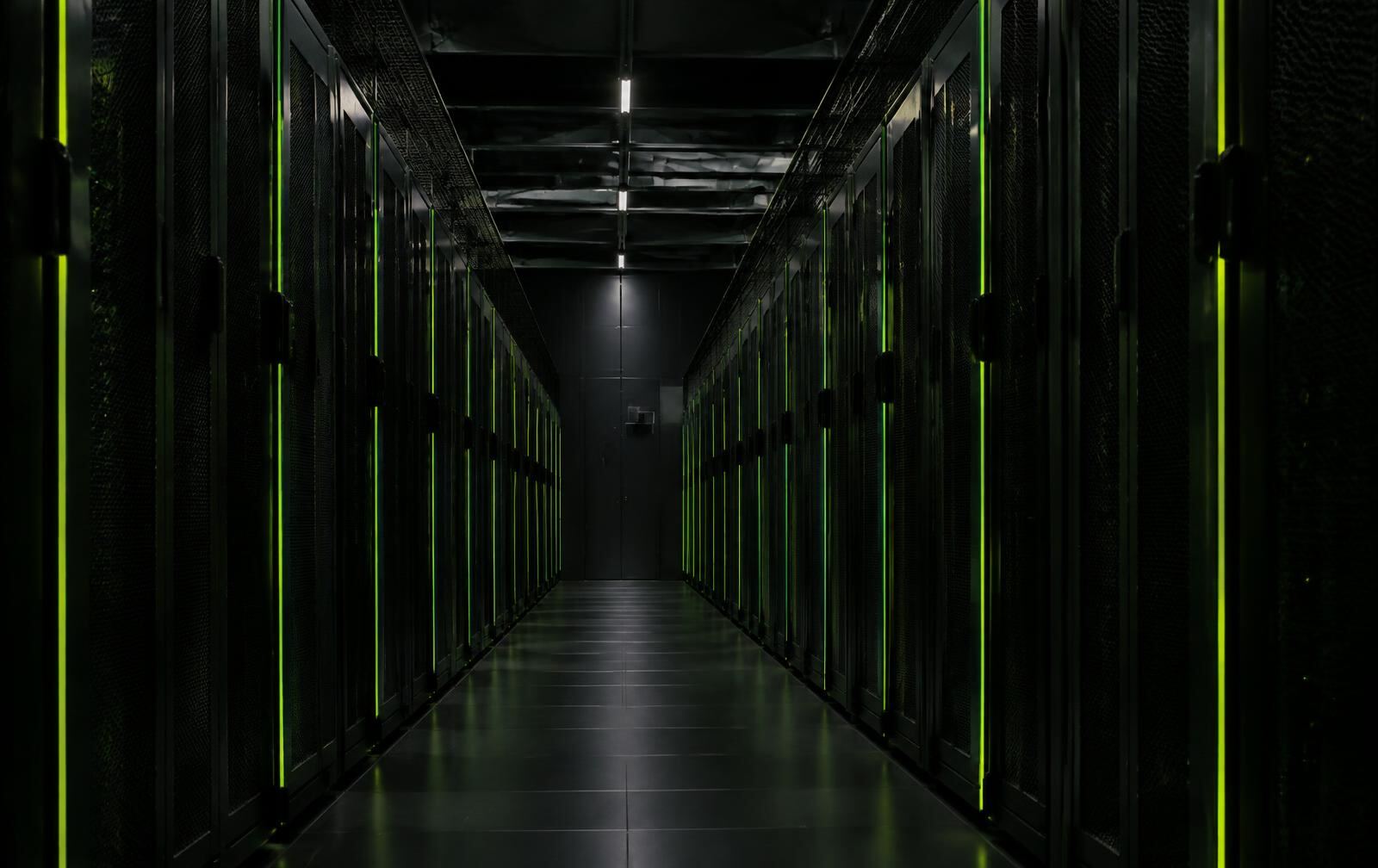 Server racks with green light strips in a data center
